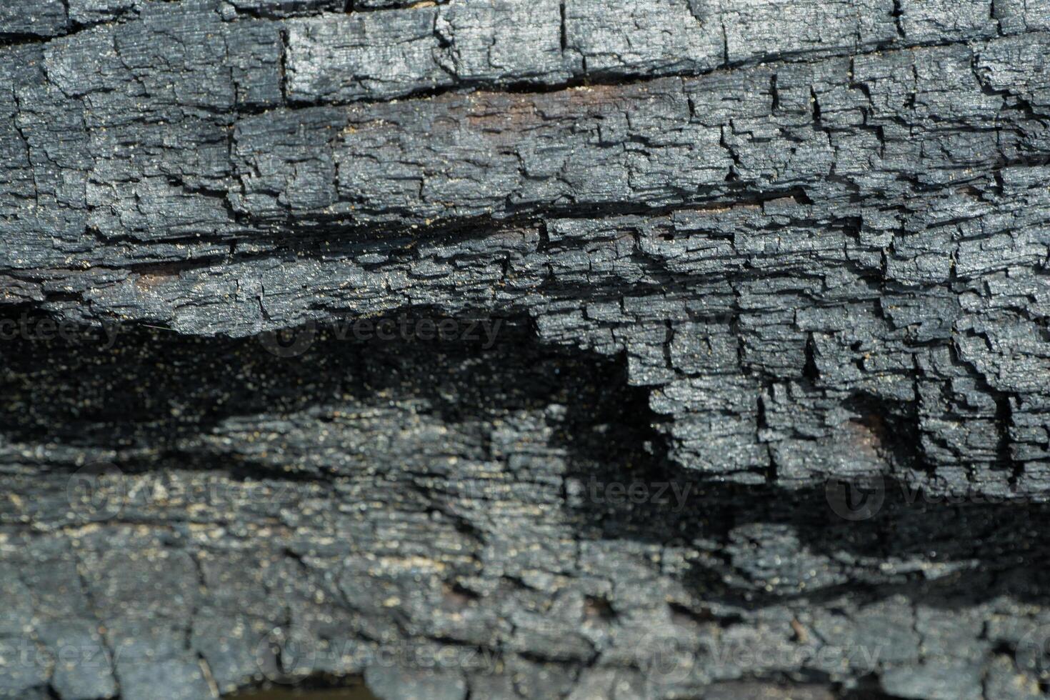 wood texture background burning and turning into wood charcoal. photo concept for forest burning, illegal logging causing climate change