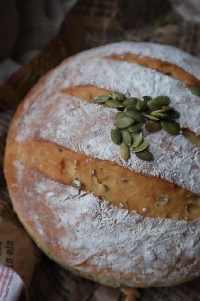 Homemade sourdough bread fresh baked with vegetables and greens decoration photo
