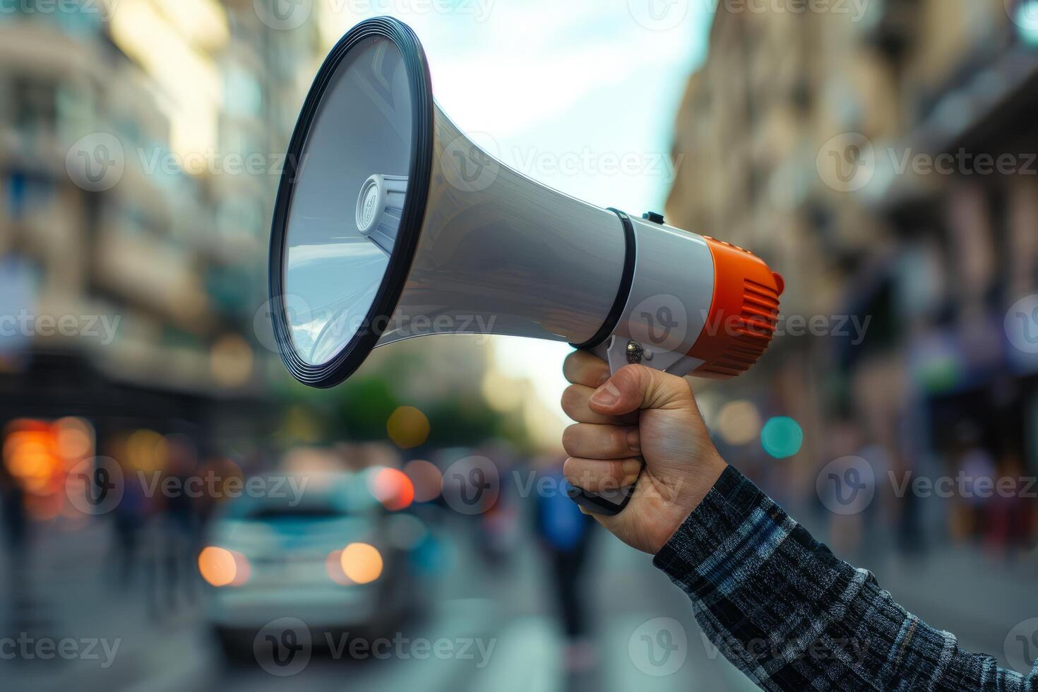 Megaphone in the hand of a man on the street photo