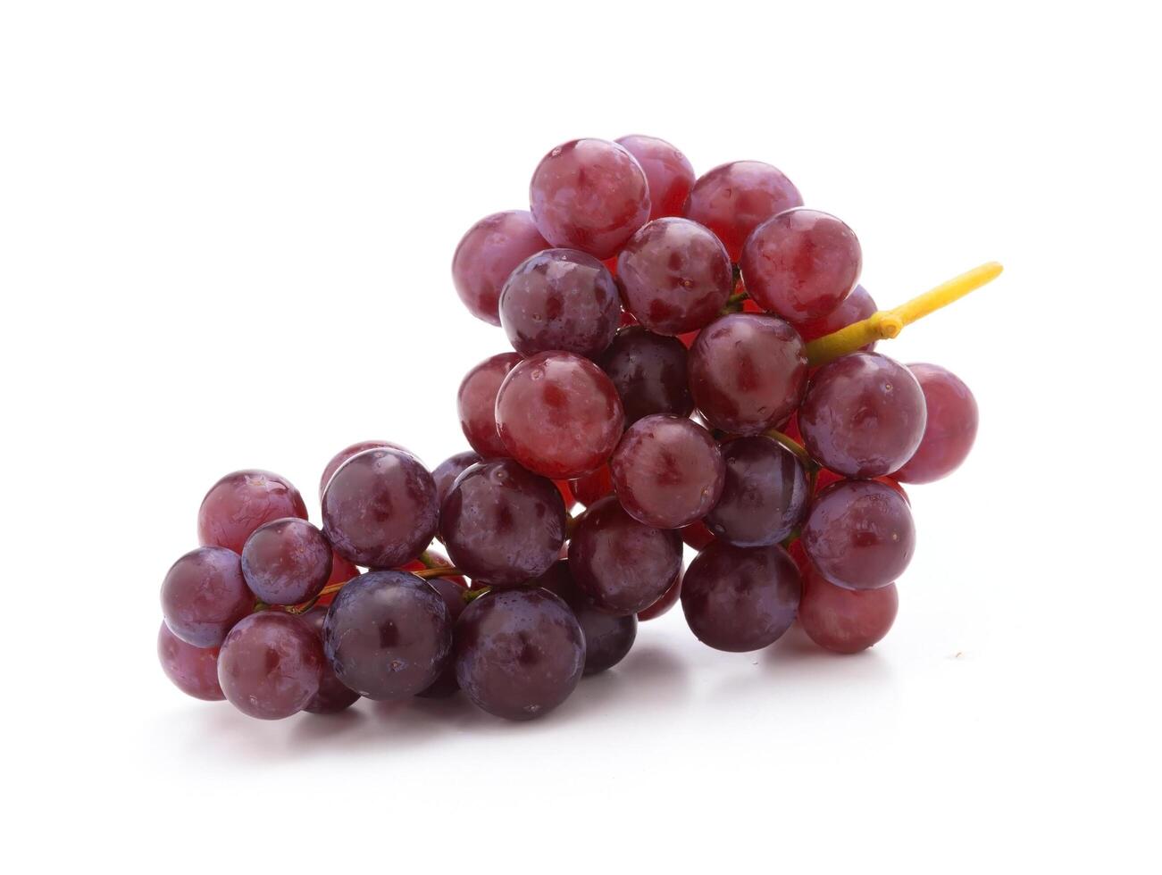 fresh red grapes isolated on a white background photo