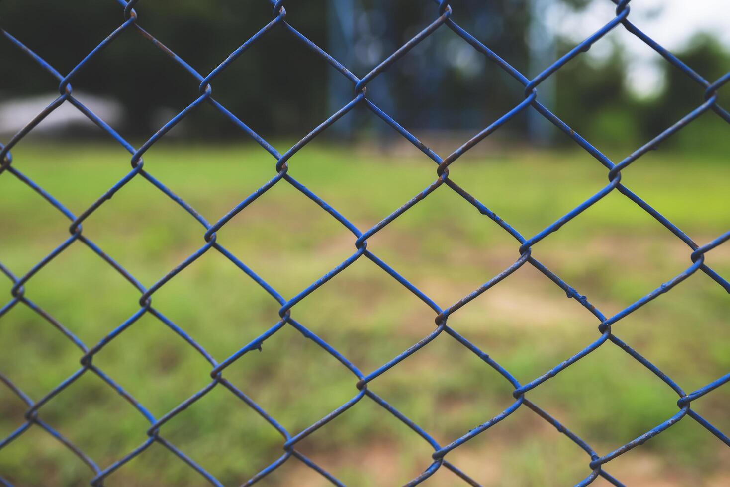 Chain link fence with blurred background . demarcation concept photo
