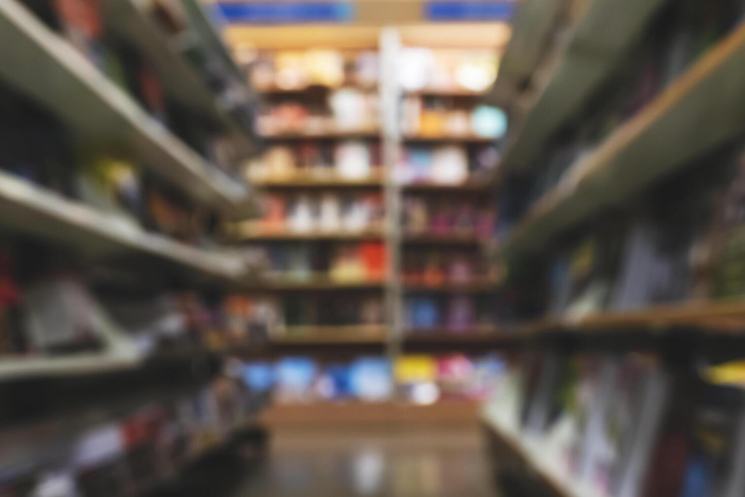 abstract blur background of bookshelf in library photo