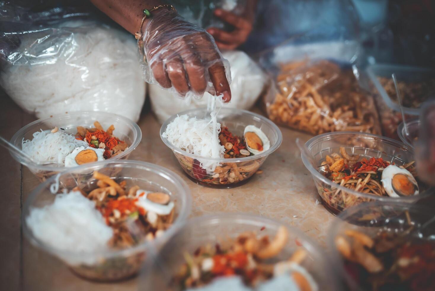 Volunteers prepare meals for the poor and hungry in the community. photo