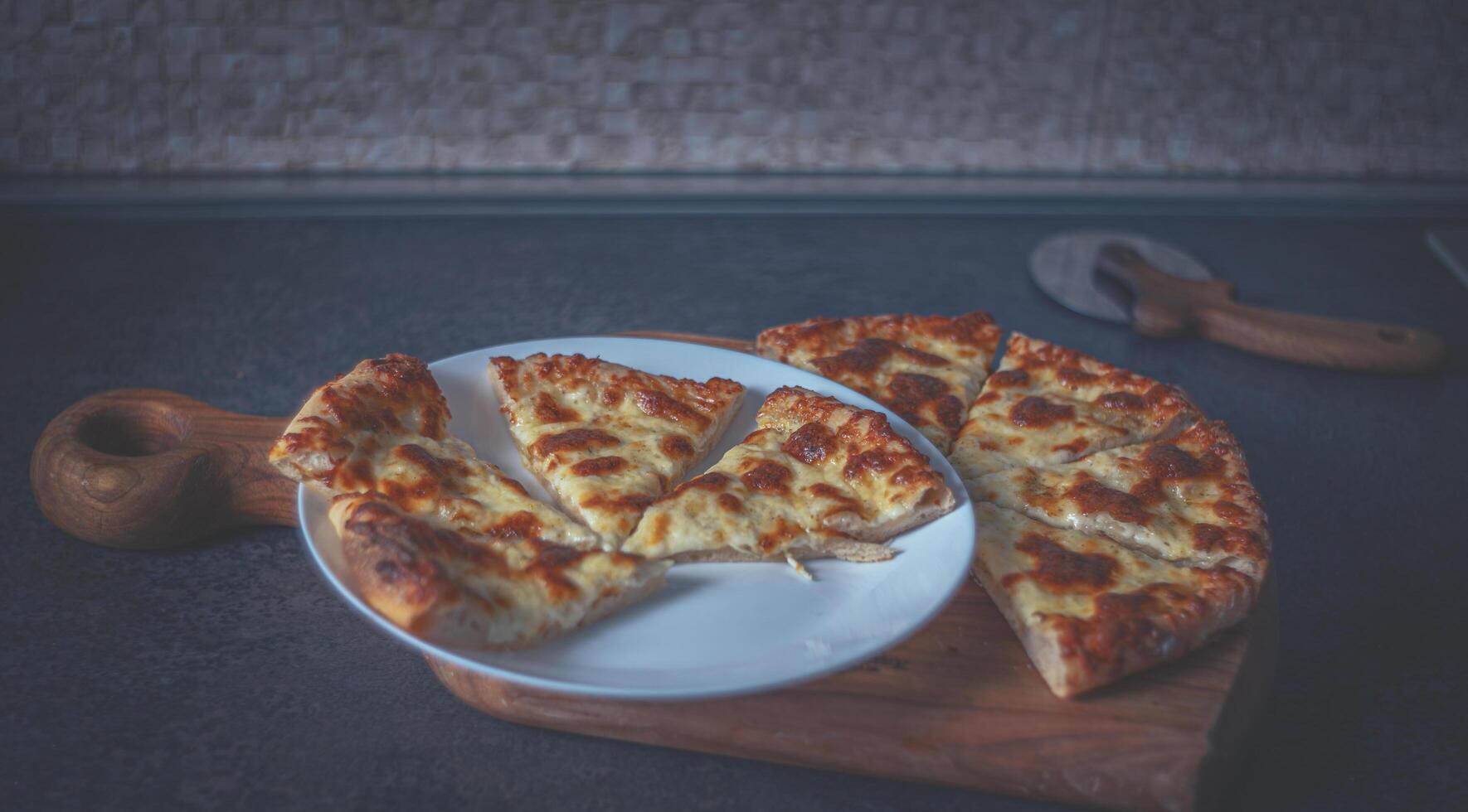 Homemade pizza with cheese. Pizza knife photo