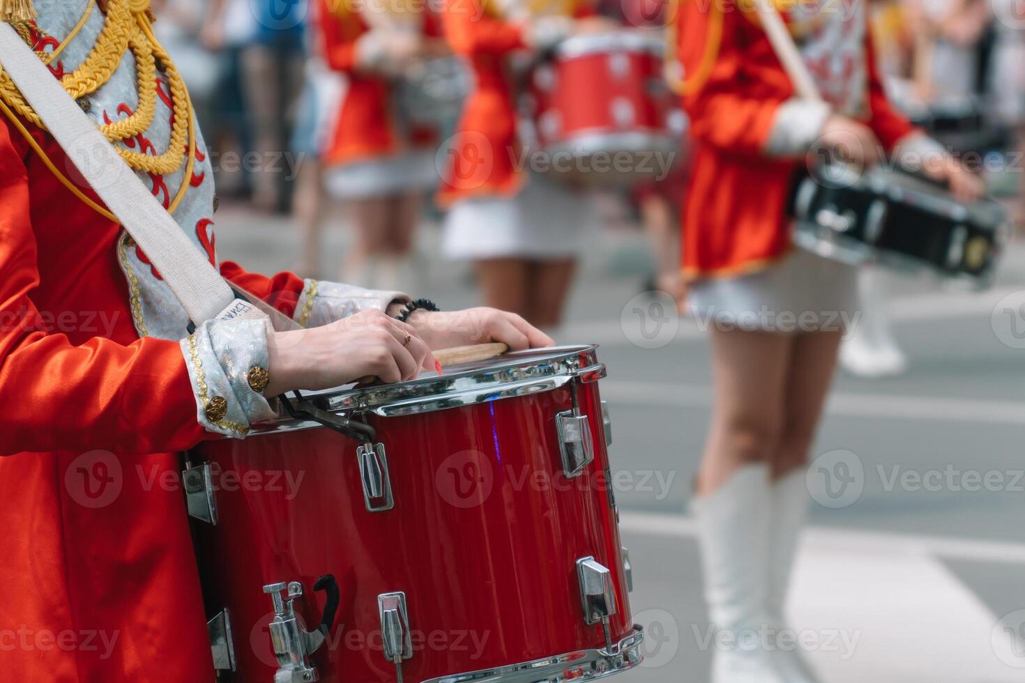 Young girls drummer at the parade. Street performance. Majorettes in the parade photo
