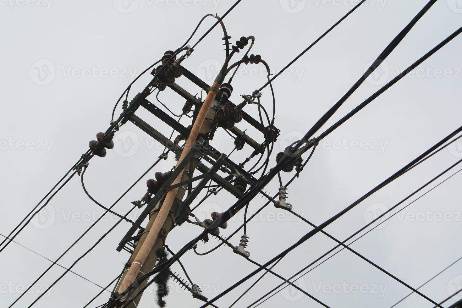 Photo of utility poles, electricity poles with messy wires.