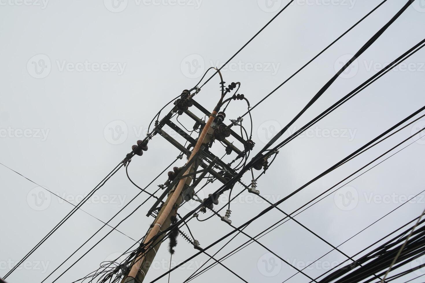 Photo of utility poles, electricity poles with messy wires.