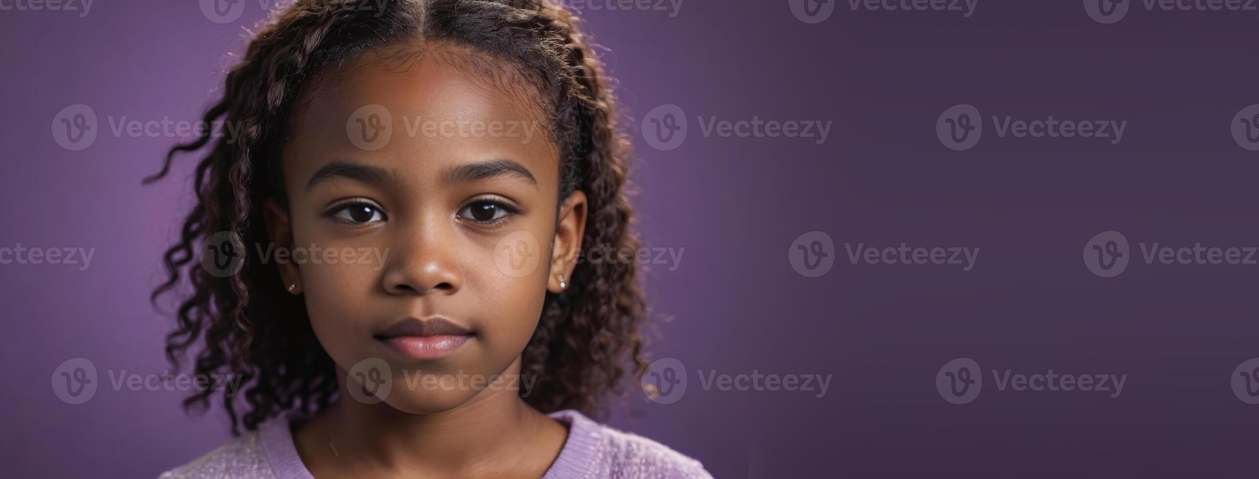 An African American Juvenile Girl Isolated On A Amethyst Background With Copy Space. photo