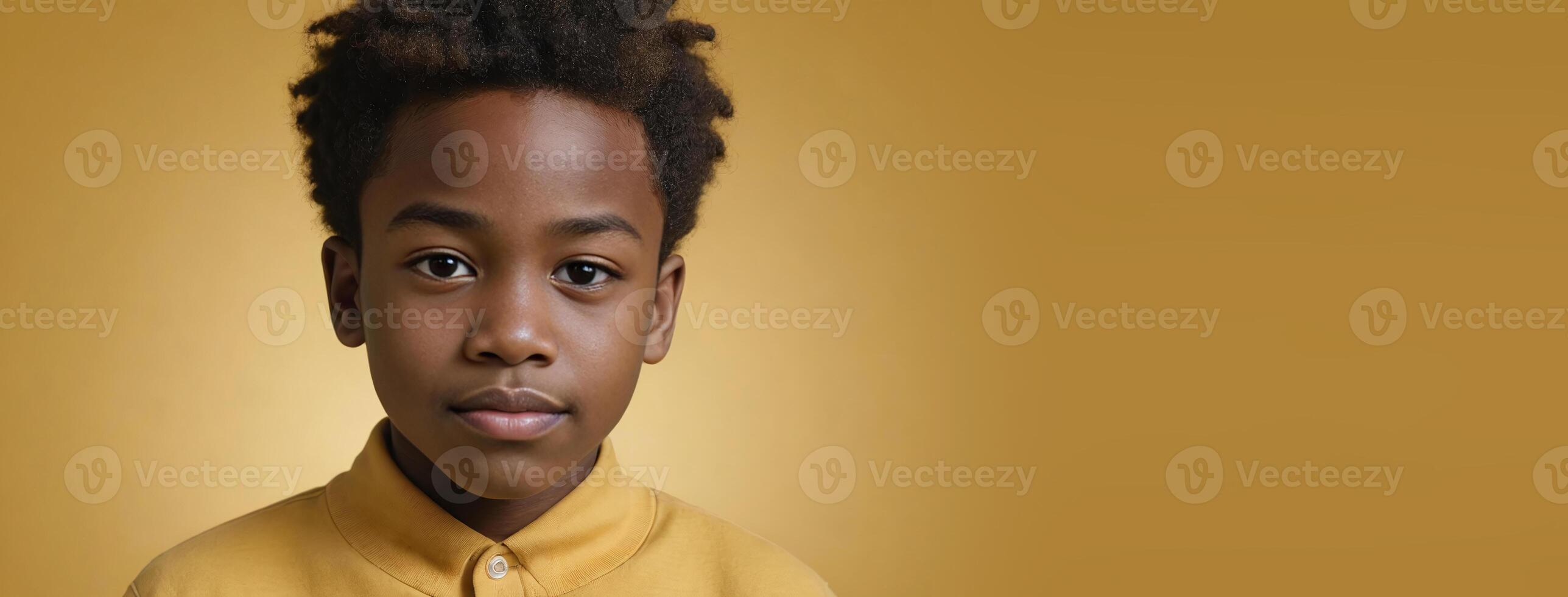 An African American Kinfolk Boy Isolated On A Yellow Background With Copy Space. photo