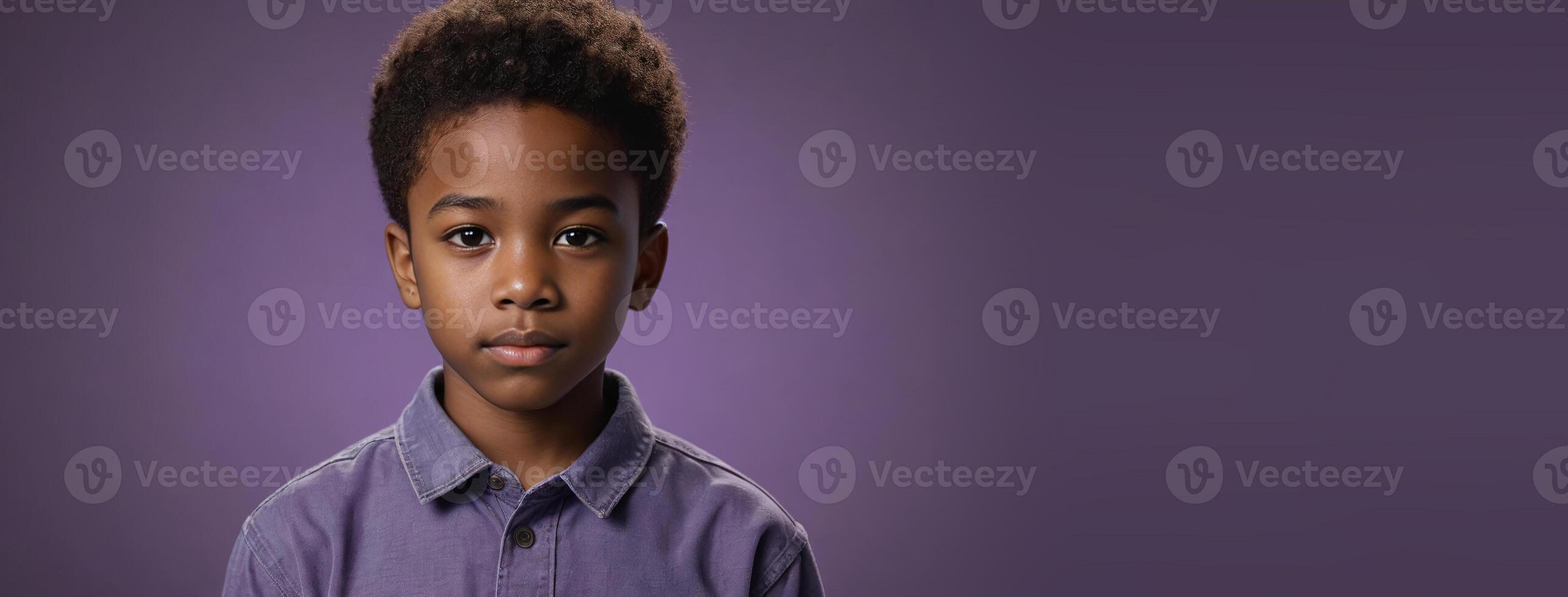 An African American Kinfolk Boy Isolated On A Amethyst Background With Copy Space. photo