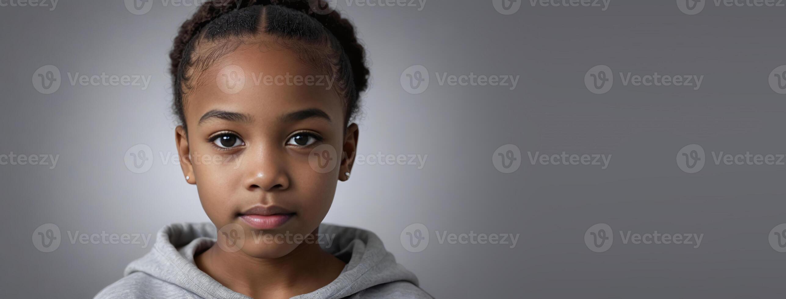 An African American Youthful Girl Isolated On A Silver Background With Copy Space. photo