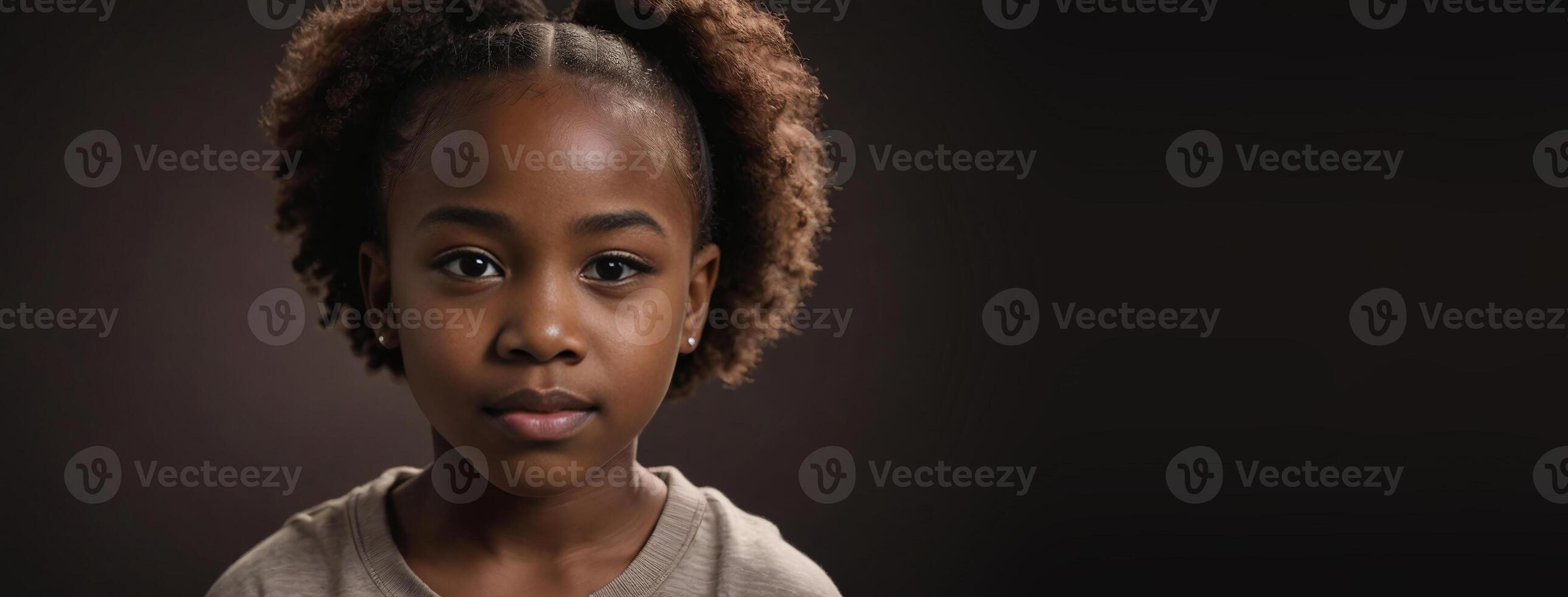 An African American Youthful Girl Isolated On A Dark Brown Background With Copy Space. photo