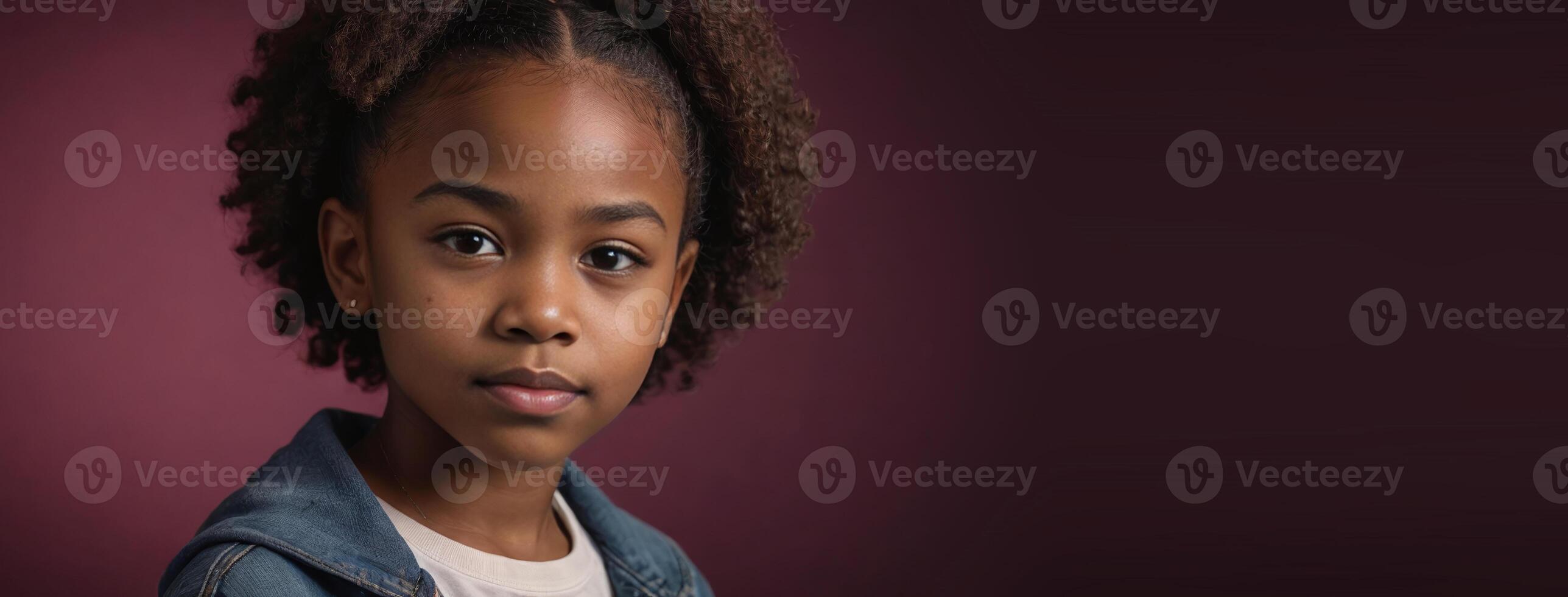 An African American Juvenile Girl Isolated On A Ruby Background With Copy Space. photo
