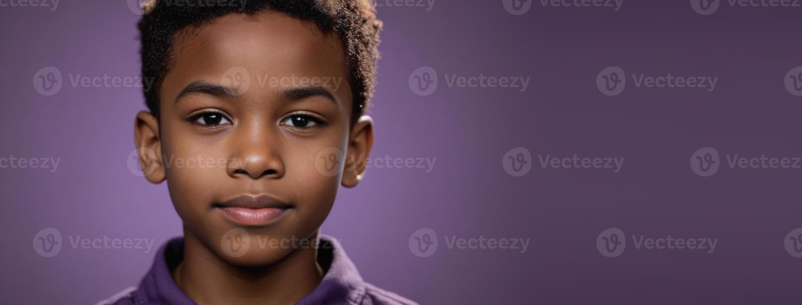 An African American Juvenile Boy Isolated On A Amethyst Background With Copy Space. photo