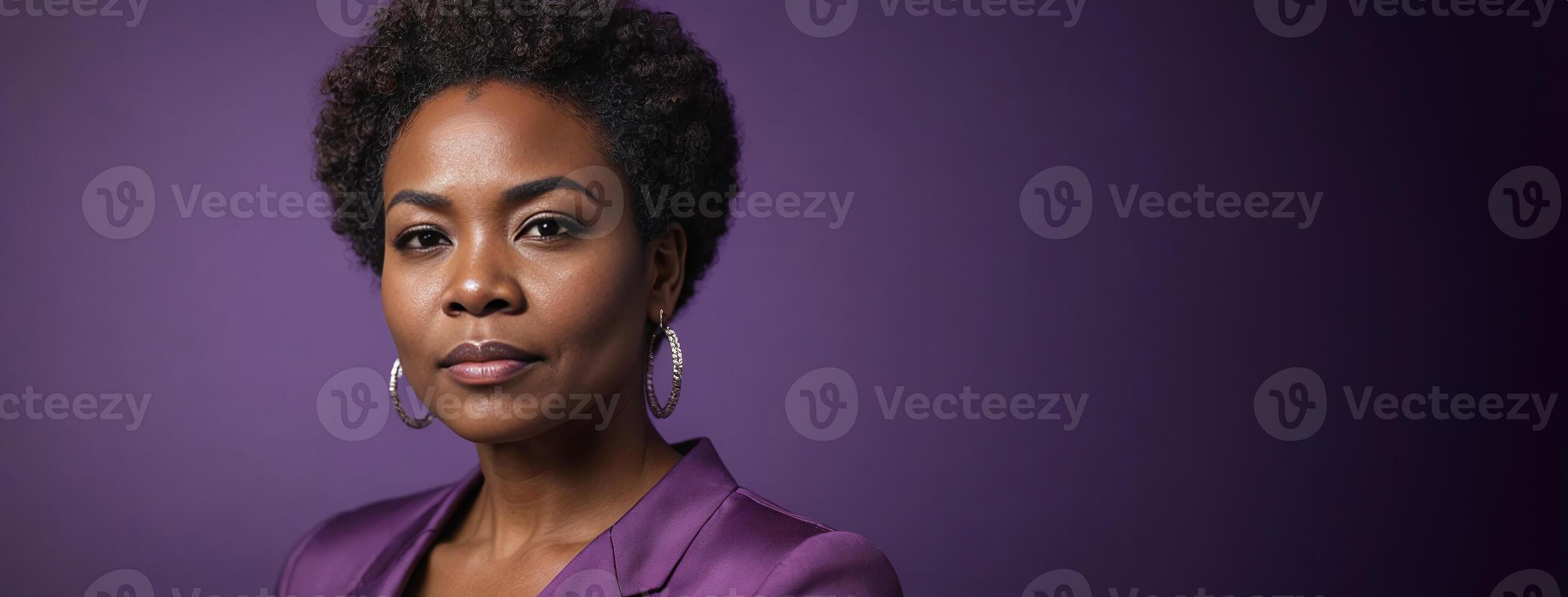 A 50S Adult African American Woman Isolated On A Purple Background With Copy Space. photo