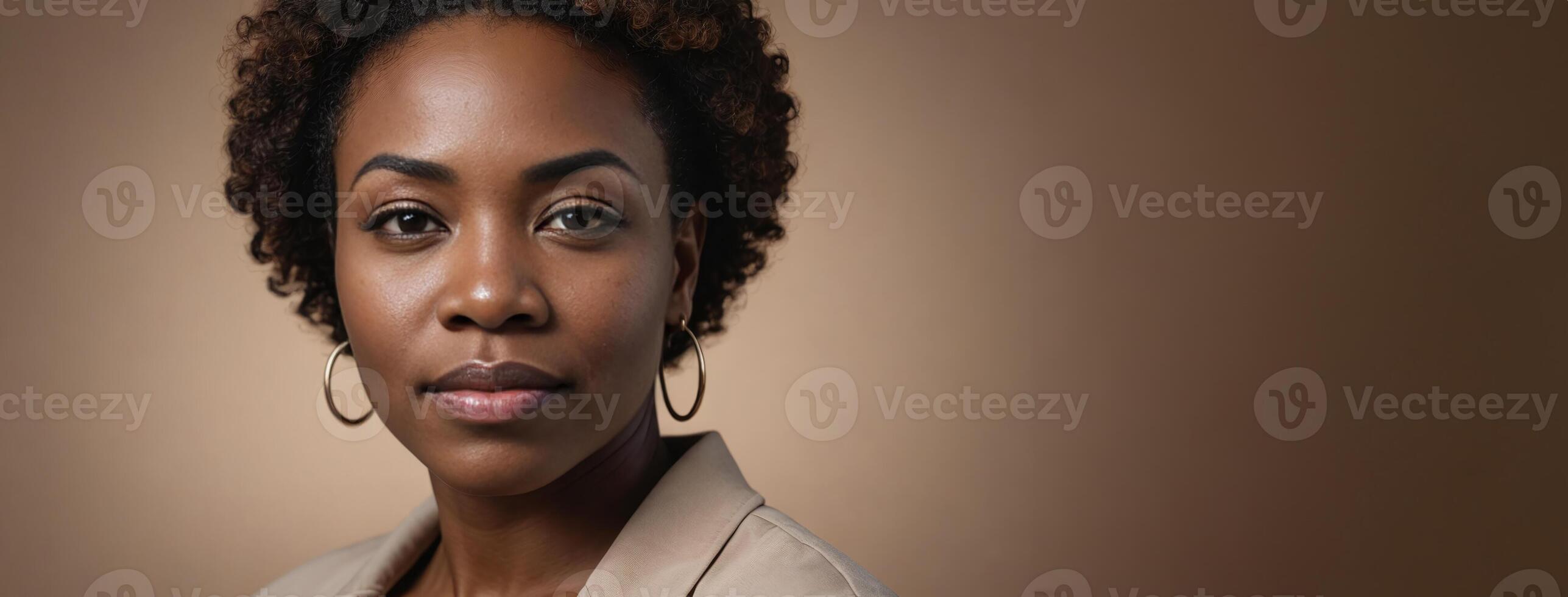 A 50S Adult African American Woman Isolated On A Hazel Background With Copy Space. photo