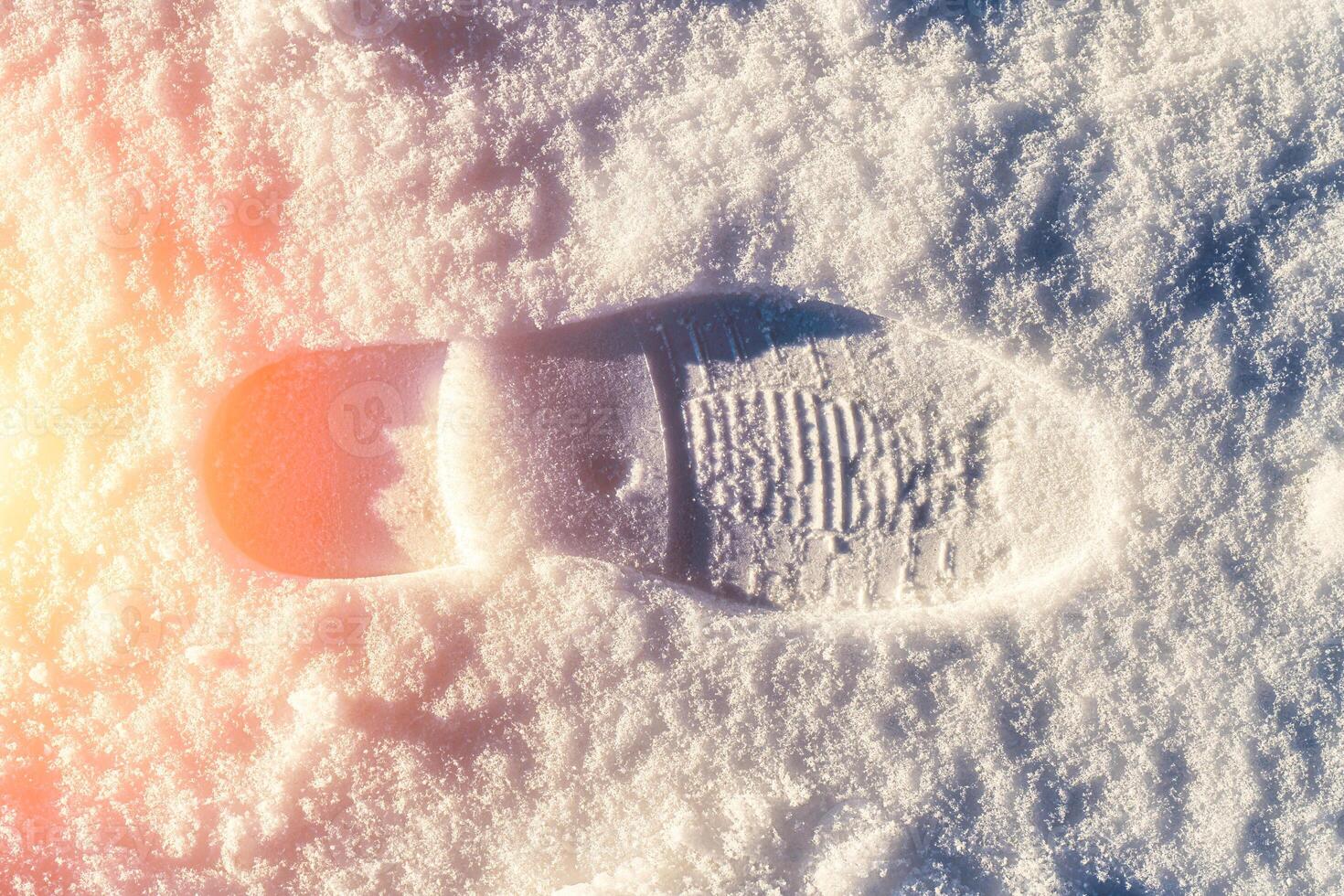 Boot track on a snow in winter. photo