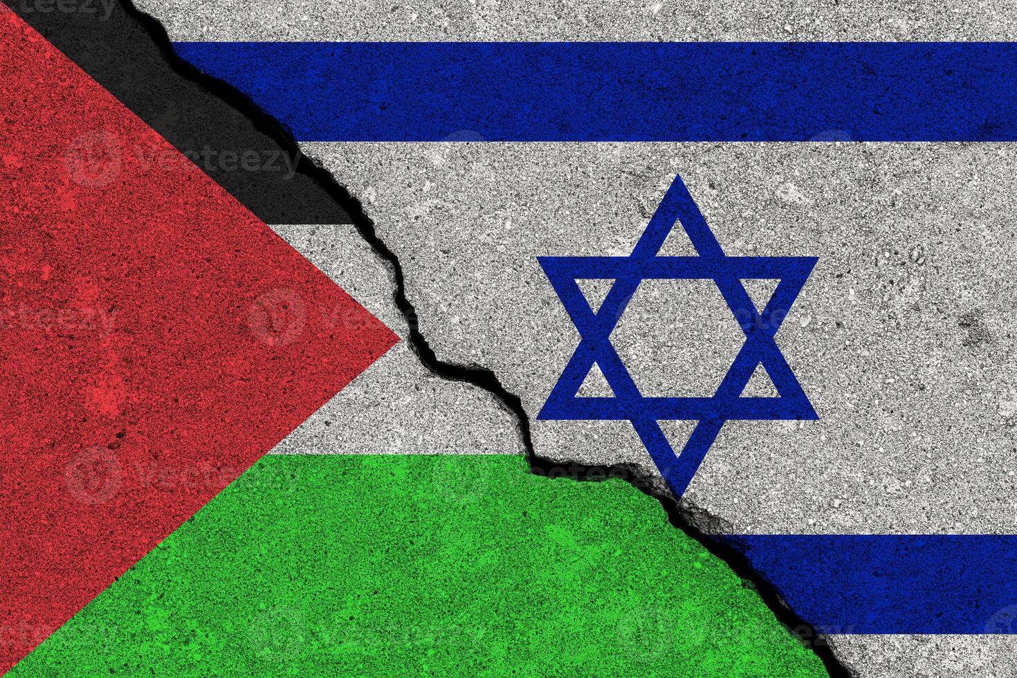 The crack between the Palestine and Israel flags on the concrete wall. The concept of sanctions, conflict and war. photo