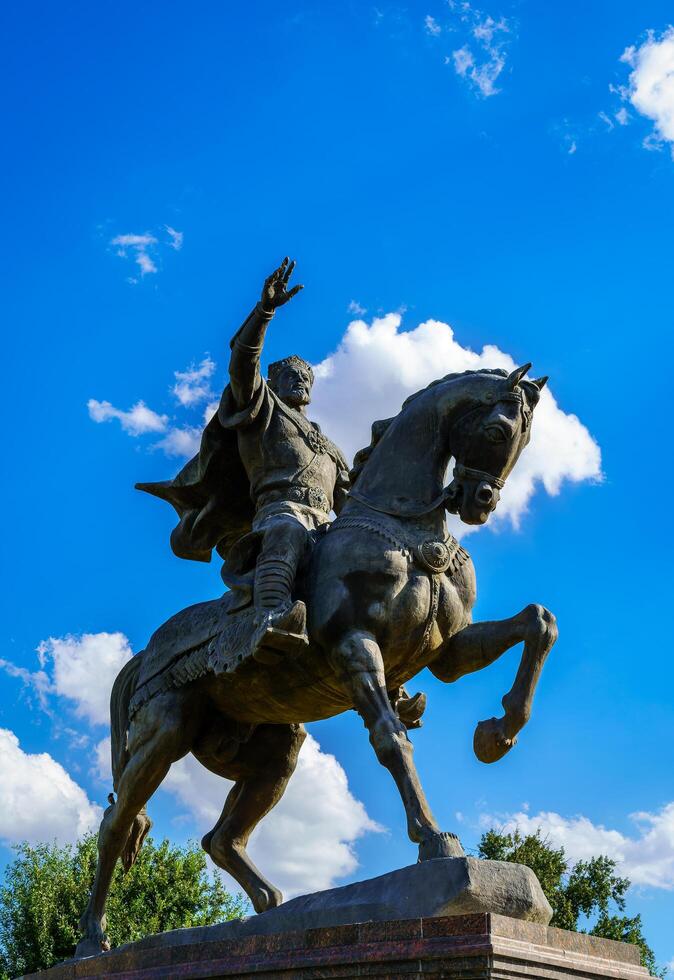 Tashkent, Uzbekistan - September 29, 2023 Monument Amir Timur or Tamerlane on a sunny day with cloudy sky. photo