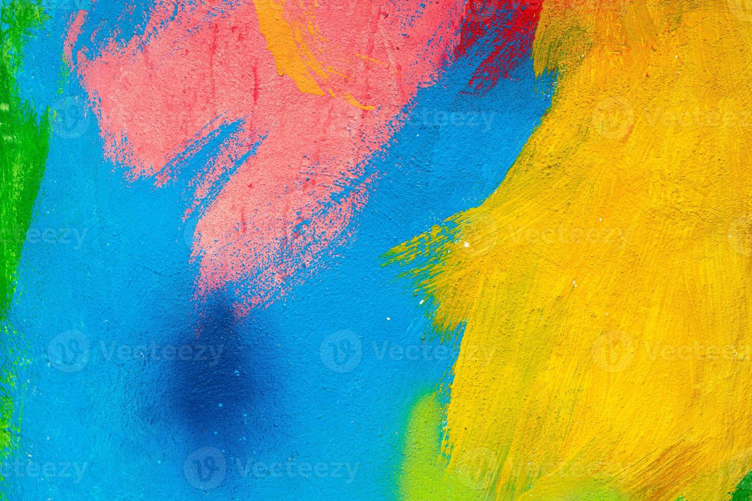 A fragment of colorful graffiti painted on a wall. Abstract urban background. Spray painting art. photo