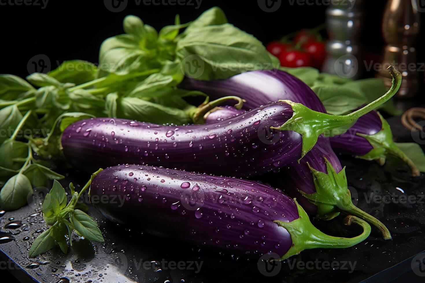 Raw purple eggplants with water drops on a dark background photo