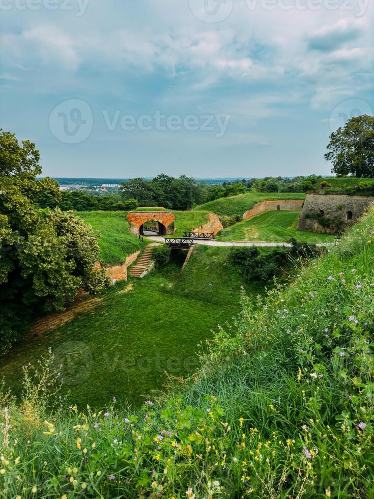 Park with green hills and historical architecture at the Petrovaradin Fortress photo
