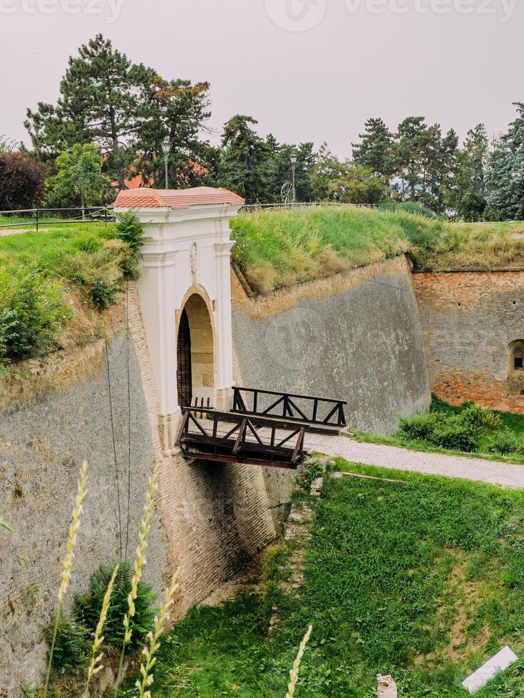 Park with green hills and historical architecture at the Petrovaradin Fortress photo