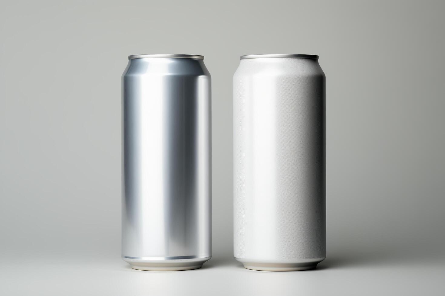 Two aluminum soda cans lined up next to each other on a flat surface. photo