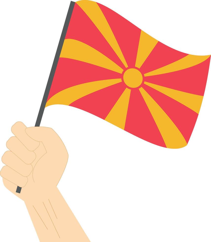Hand holding and raising the national flag of Macedonia vector