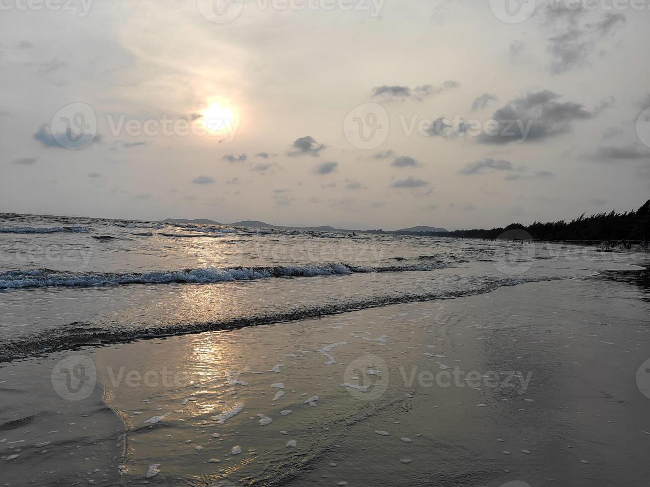 Sunset on the sandy beach photo