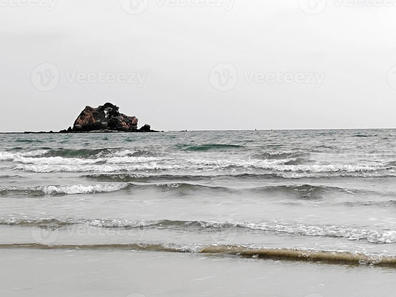 waves on the beach in sunny day photo