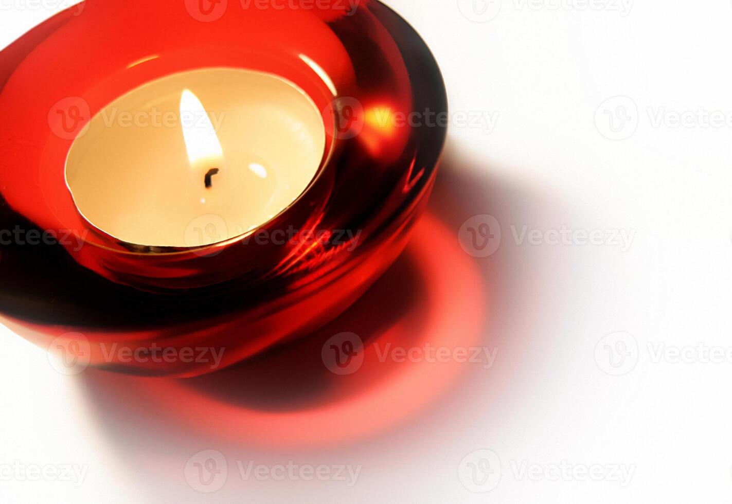 Burning bright candle on white backgrouns photo