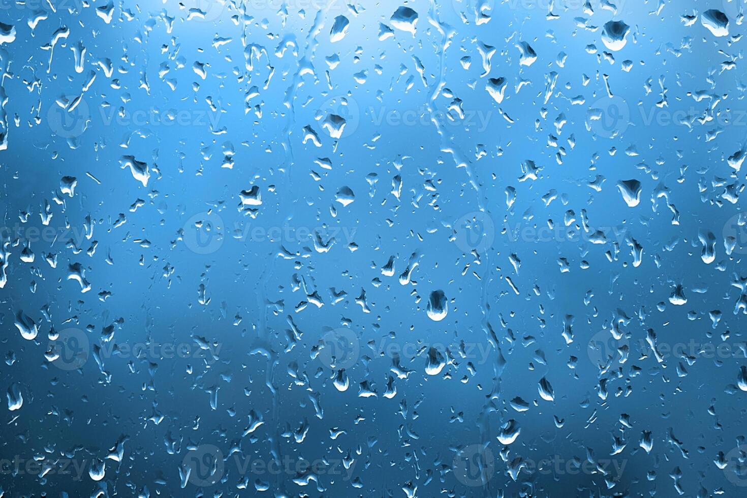 agua gotas en vaso, de cerca natural azul antecedentes foto