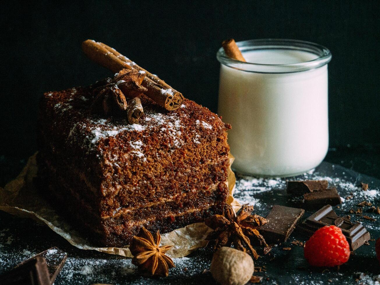 chocolate cake with cinnamon and spices on a dark background photo