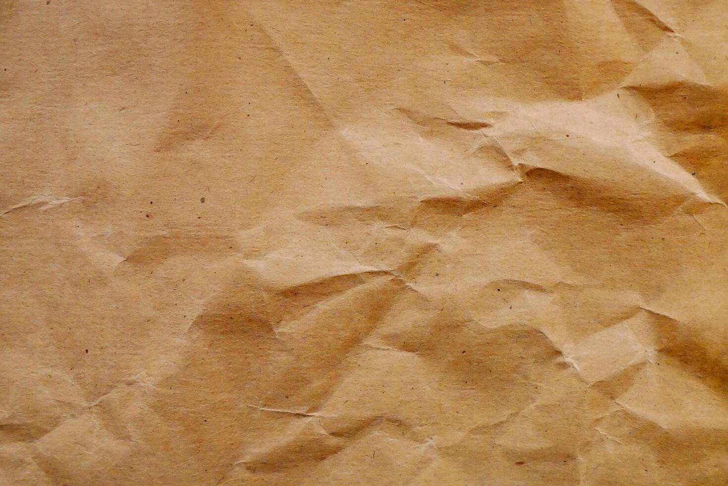 a brown paper texture with crumpled edges photo