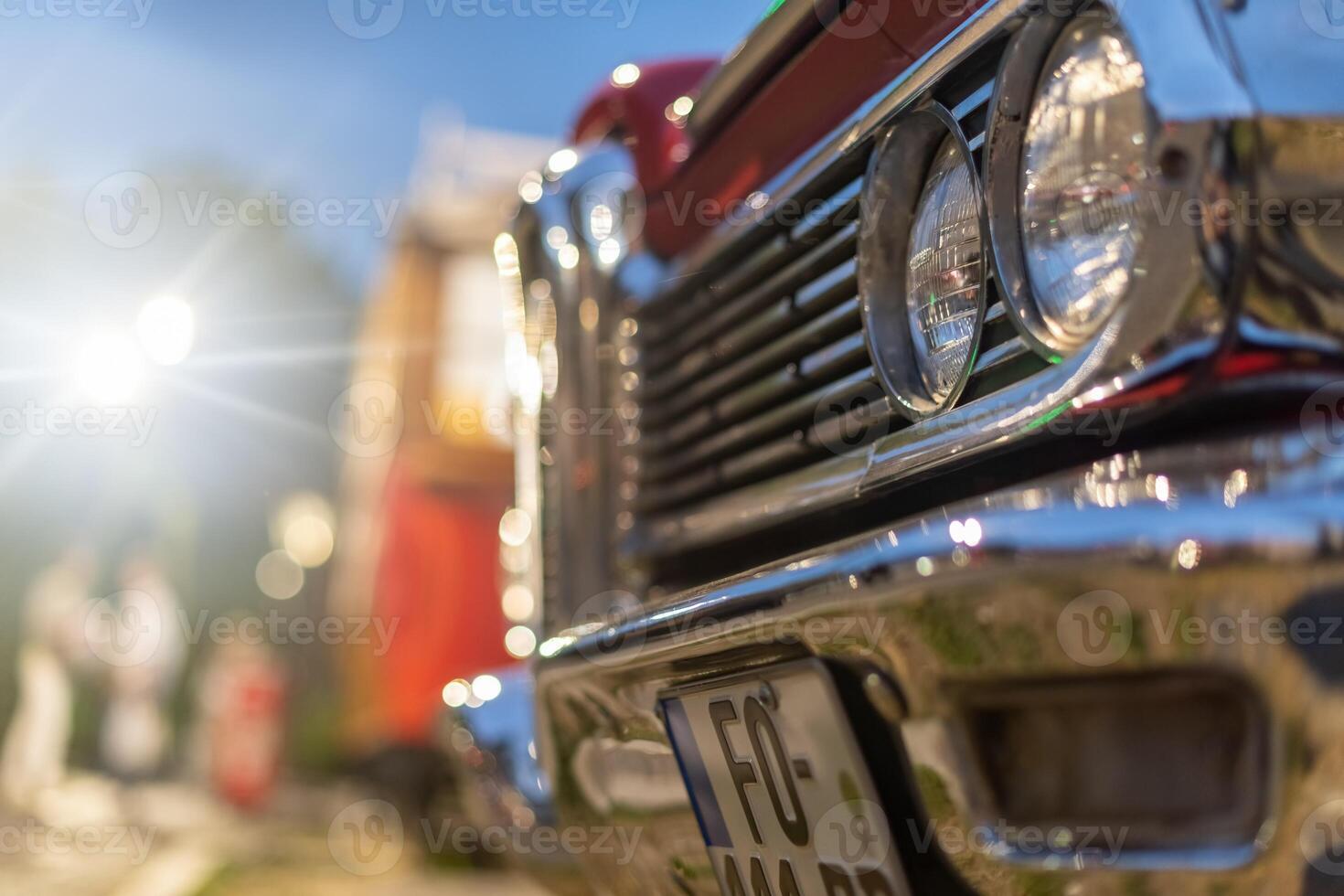 Close-up of the headlights of an American retro car. photo