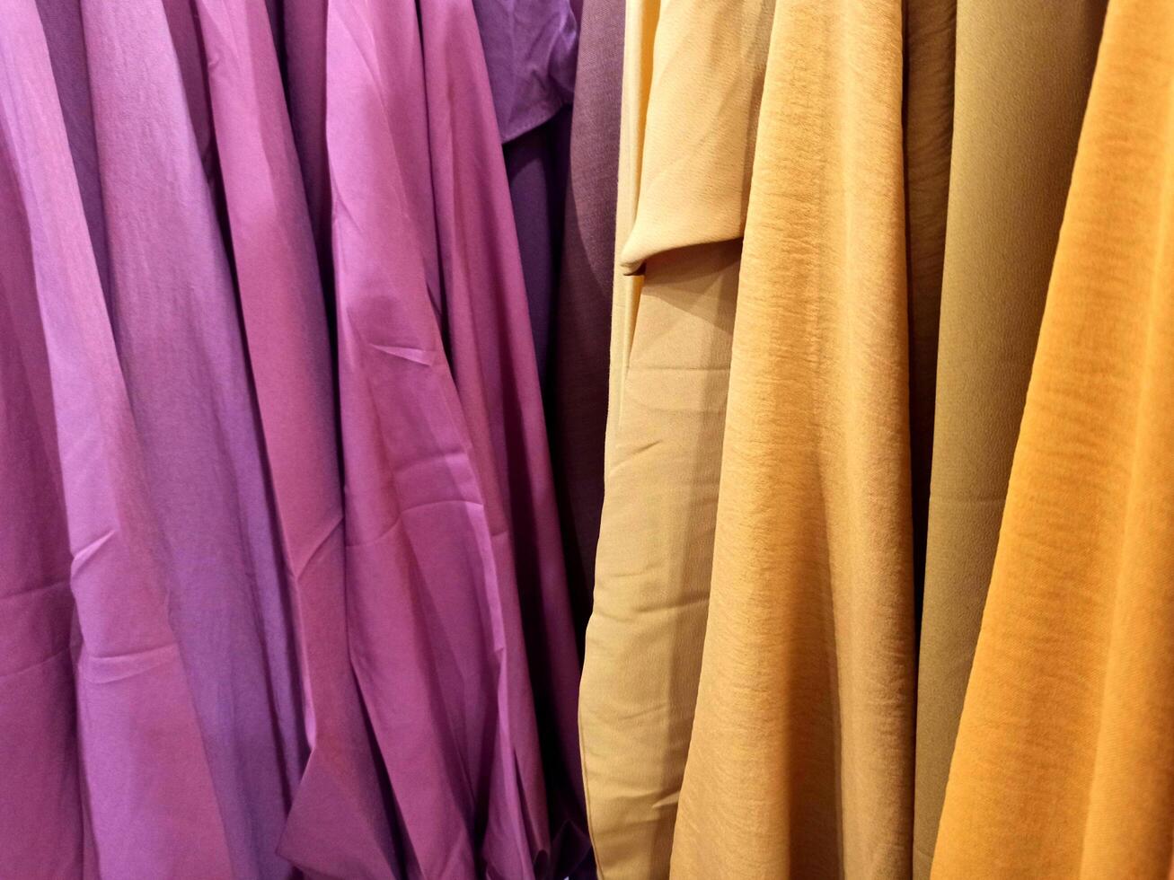 Colorful skirts displayed in fashion store photo