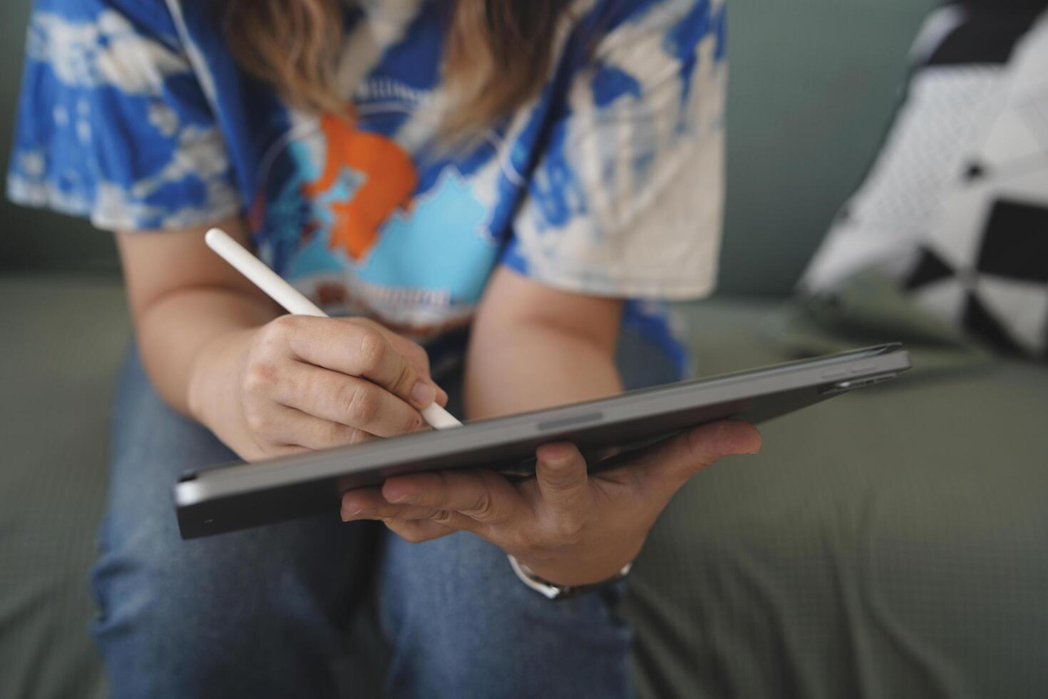 person using digital tablet in office photo