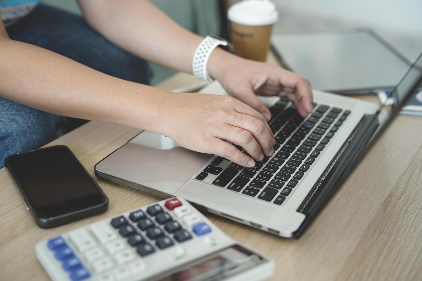 person using laptop payment credit card shopping online photo