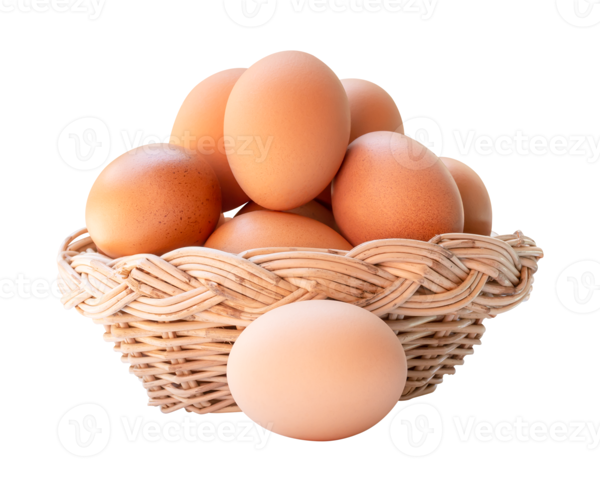 Front view of fresh brown chicken eggs in stack in wicker basket isolated with clipping path in file format png