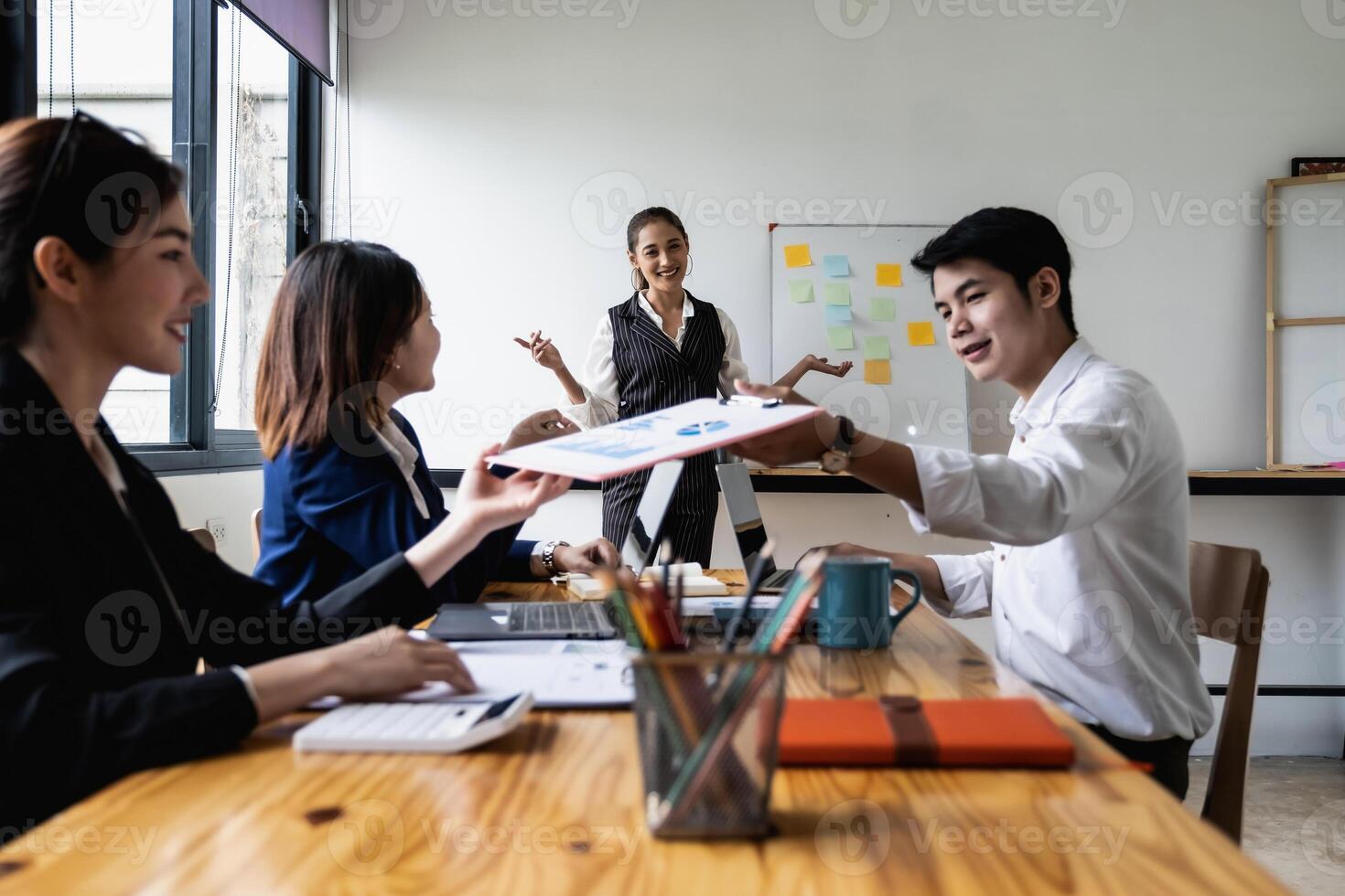 Group of Businessman and Accountant checking data document on digital tablet for investigation of corruption account . Anti Bribery concept. selecetive focus photo