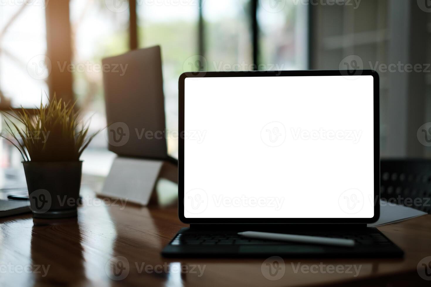 White blank screen digital tablet on modern working desk. photo