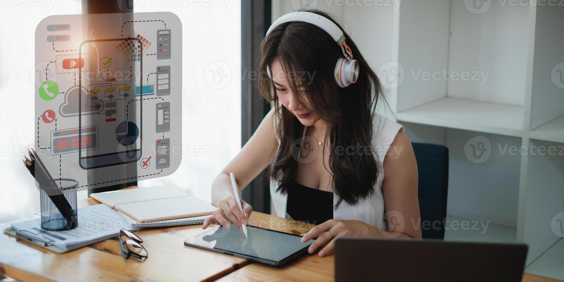 Female ux developer and ui designer sketching interface app in digital tablet in living room at home. Creative digital development agency concept. photo