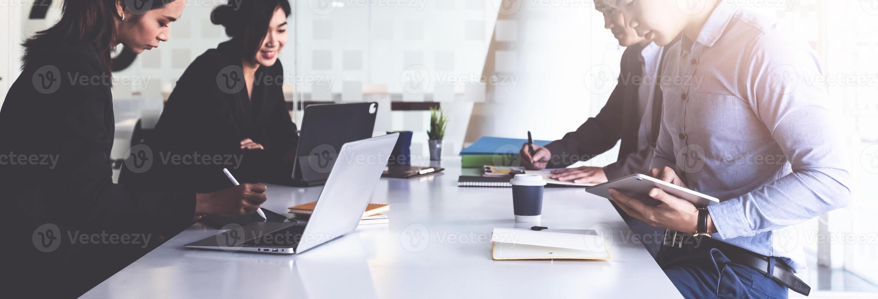 Group of Businesswoman and Accountant checking data document on digital tablet for investigation of corruption account . Anti Bribery concept. photo