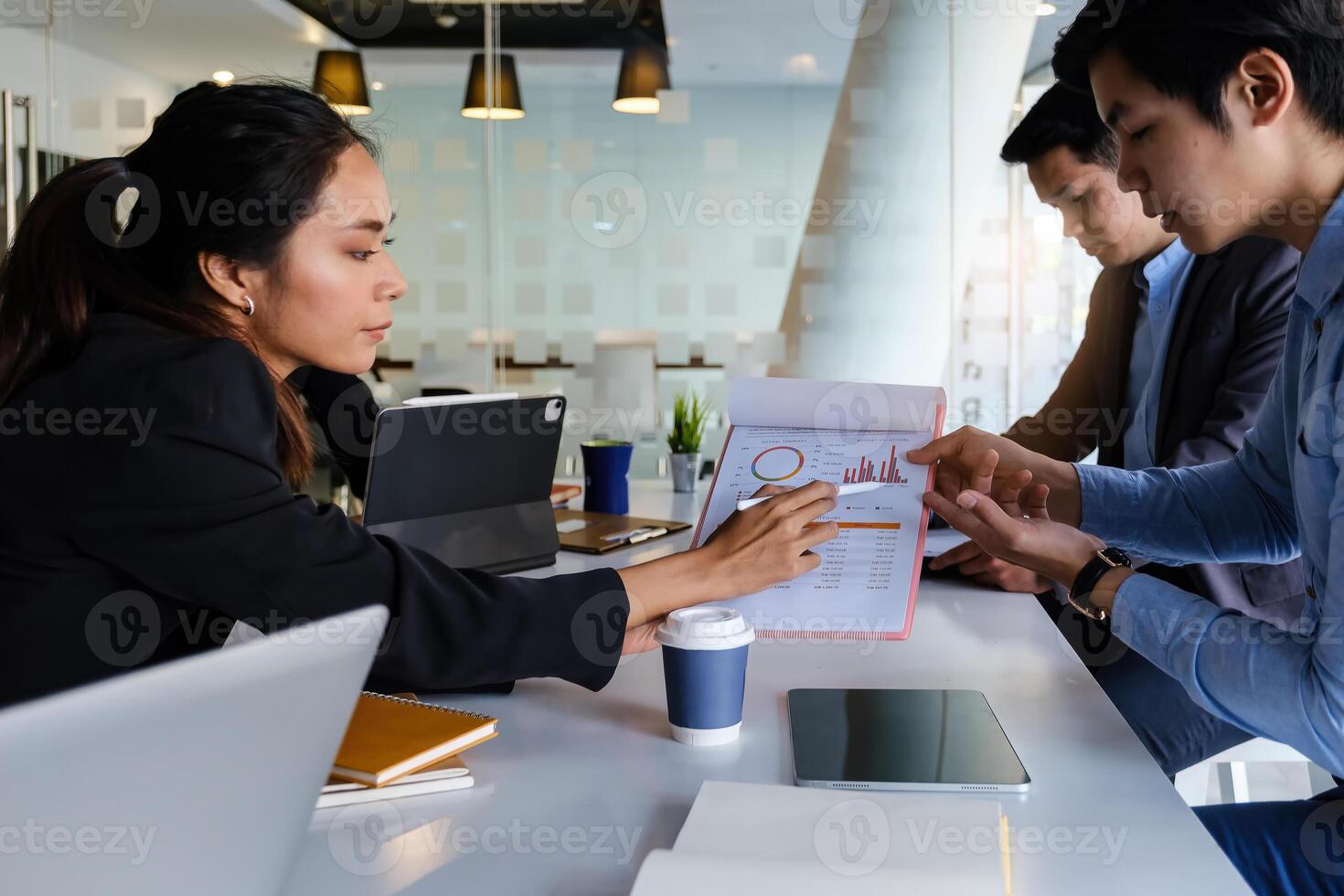 Group of Businessman and Accountant checking data document on digital tablet for investigation of corruption account . Anti Bribery concept. photo