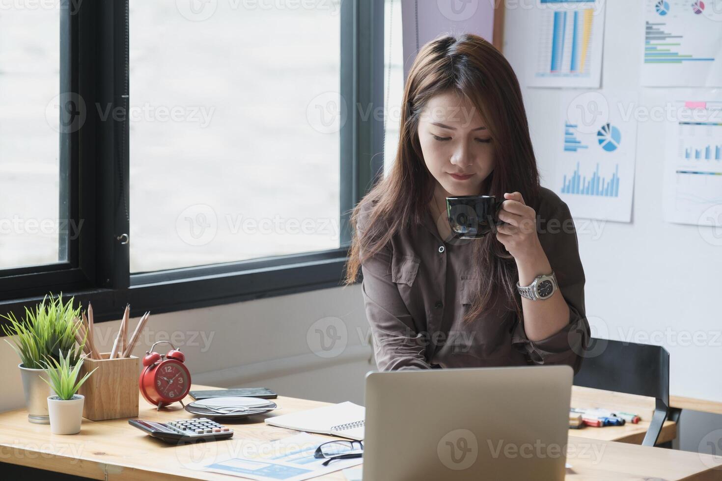 Businesswoman and Accountant checking data document on digital tablet for investigation of corruption account . Anti Bribery concept. photo