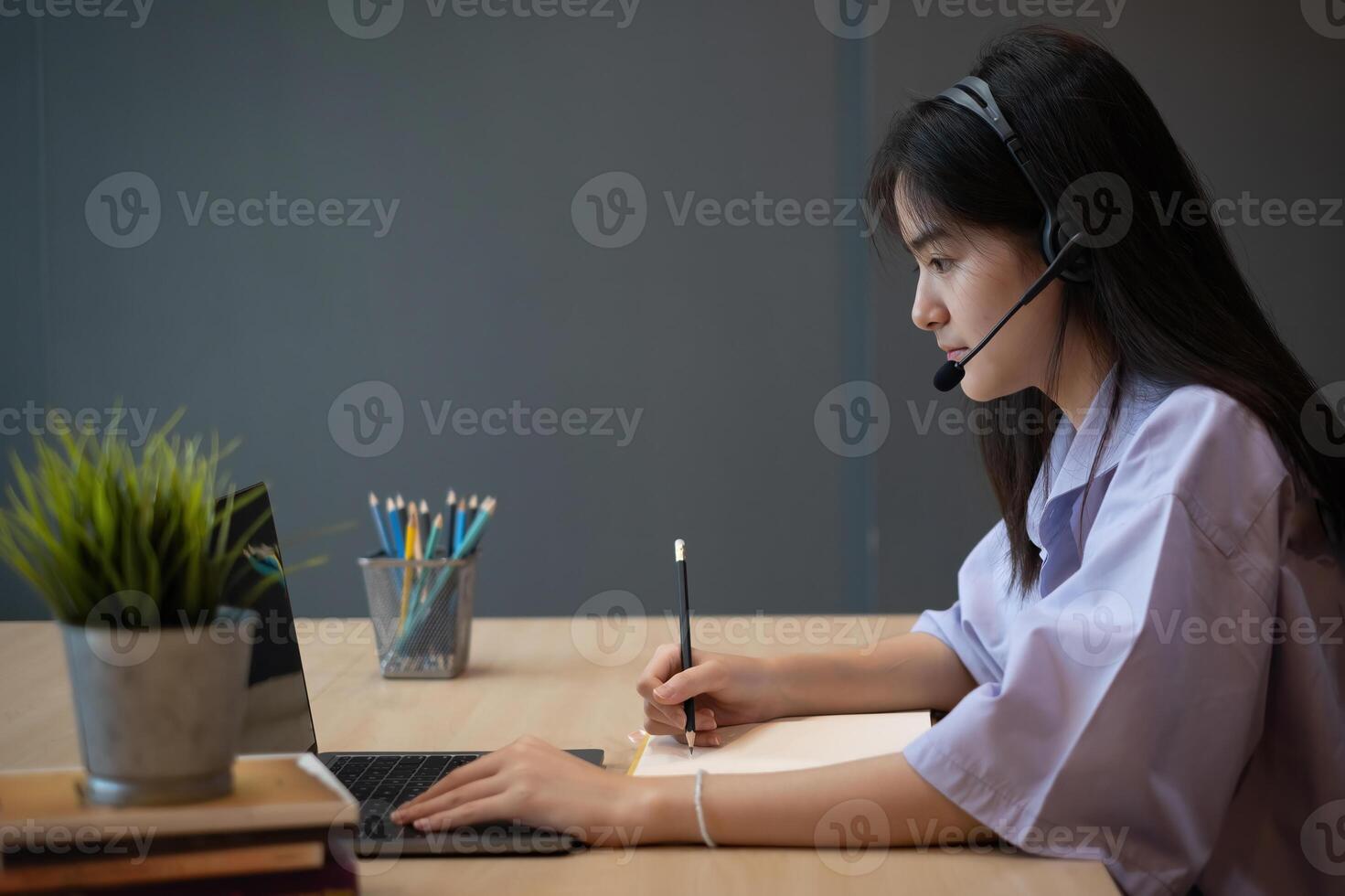 E-learning ,online ,education and internet social distancing protect from COVID-19 viruses concept. Asian woman student conference e-learning with teacher on laptop computer at home photo