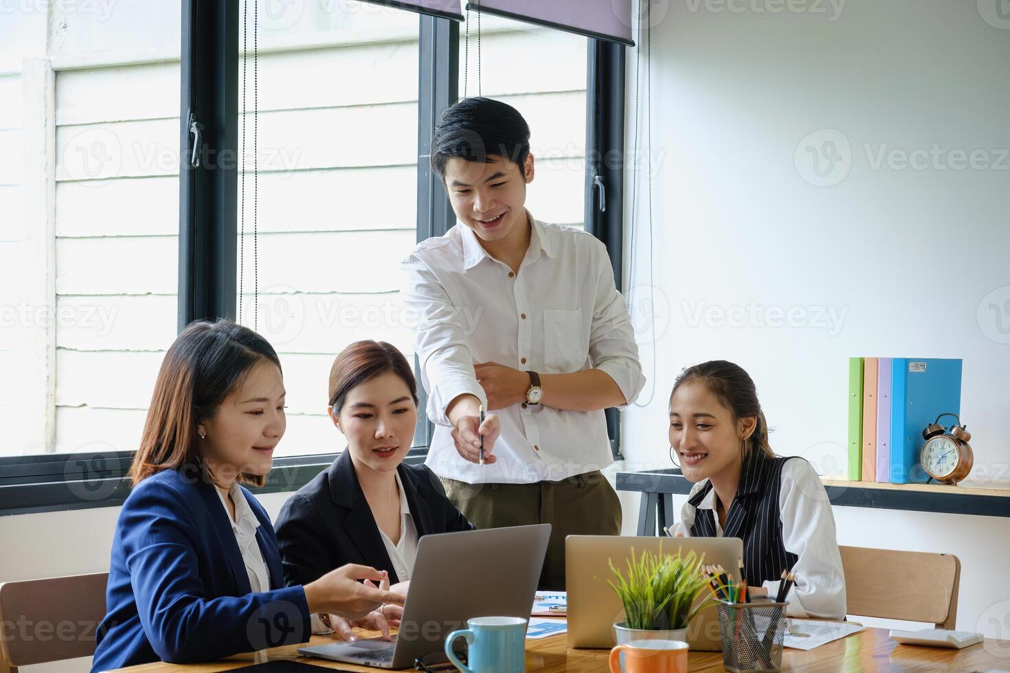 Group of Businesswoman and Accountant checking data document on digital tablet for investigation of corruption account . Anti Bribery concept. photo