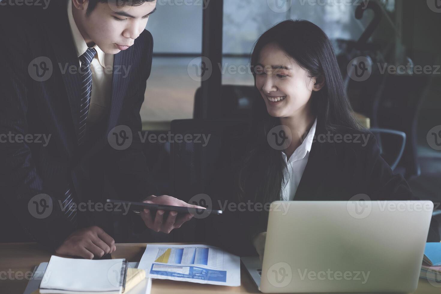 Group of Businessman and Accountant checking data document on digital tablet for investigation of corruption account. Anti Bribery concept. photo