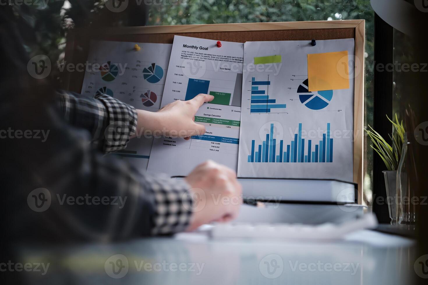 Rear view of female employee meeting via call with employee brief the stock market chart. photo